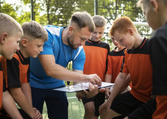 football-trainer-teaching-his-pupils